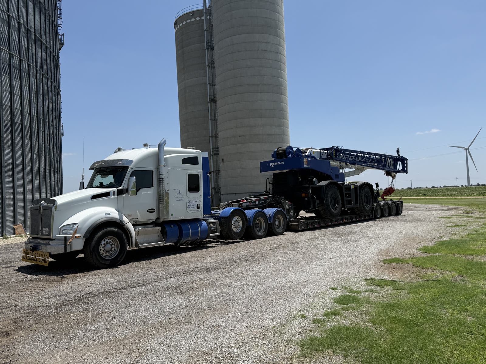 Ace Kenworth with Tadano load on rural highway